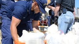 Members from the Coast Guard, Drug Enforcement Agency, Massachusetts State Police and other local and federal law-enforcement agencies offload more than 1,200 pounds of cocaine from the deck of the Coast Guard Cutter Dependable, Sept. 6, 2013. The Coast Guard seized the suspected contraband and detained two suspected smugglers during an at-sea interdiction, Sept. 2, 2013, approximately 500 miles east of Cape Cod. The drug shipment is estimated to have a wholesale value of more than $20 million. U.S. Coast Guard photo by Petty Officer 2nd Class Rob Simpson.