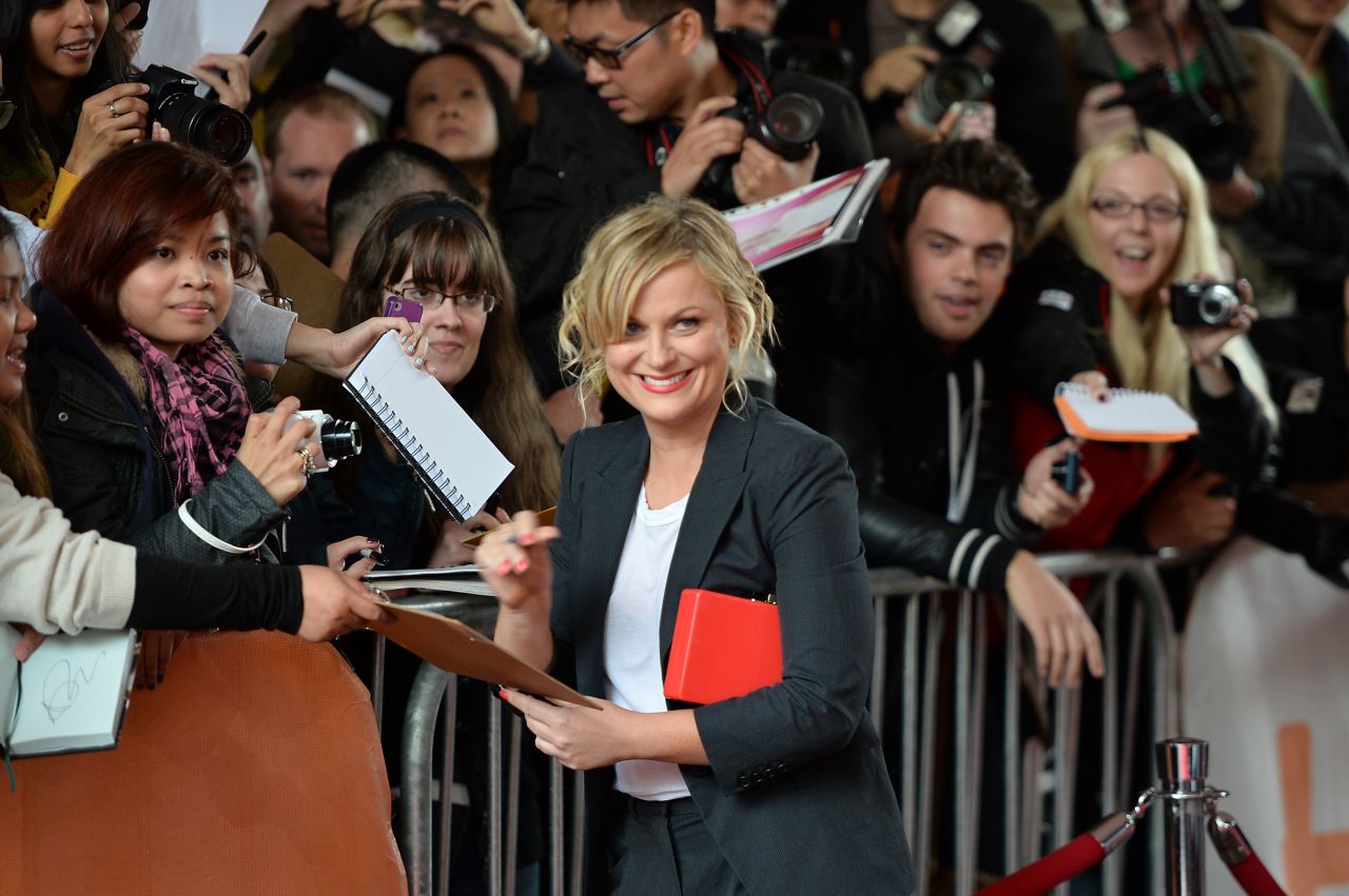 Actress Amy Poehler signs autographs at the "You Are Here" premiere at the film festival on Saturday, September 7.