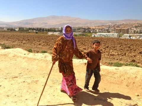 A Syrian looking for safety crosses the border into Lebanon every 15 seconds. Most of the children can be found without their parents, who stay in Syria to work and protect their homes. This boy, age 9, walks with his grandmother back to their tent. He told Gupta's producer, Danielle Dellorto, that he asks every day if they can go back home to Syria. 