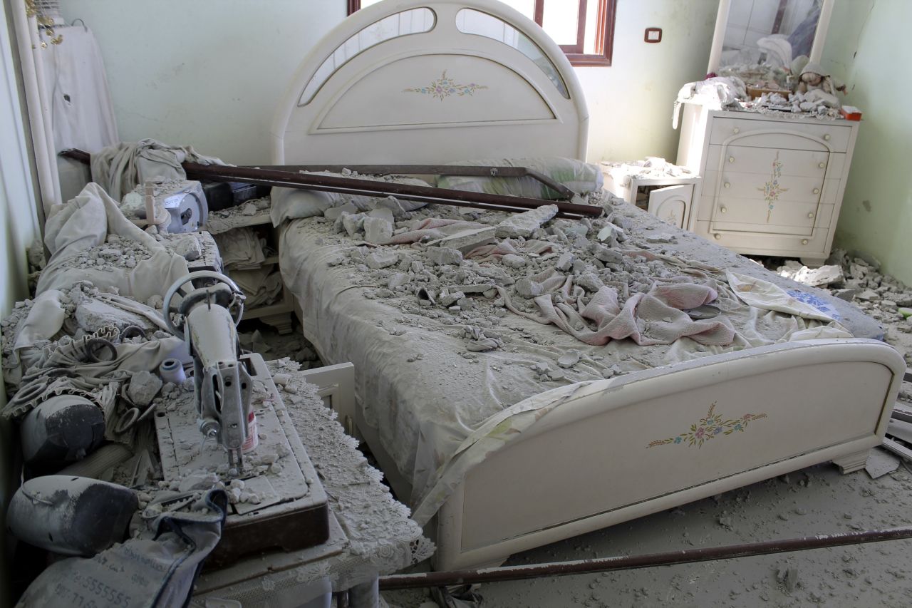 A bedroom lies in ruins after clashes between government forces and rebels around Ariha on September 7.