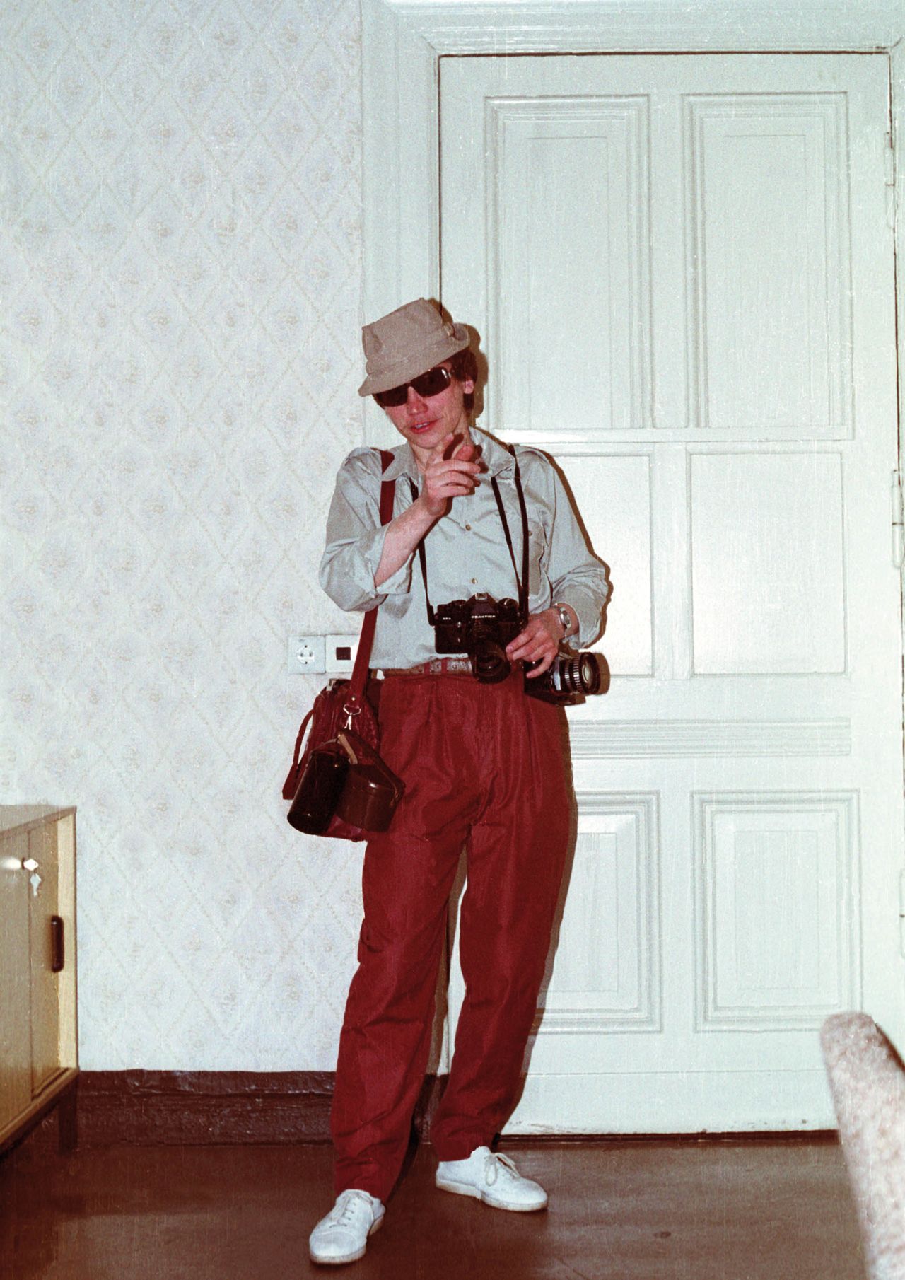 Disguises as tourists were often used to help agents appear "inconspicuous" in places frequented by Westerners. Props such as plastic shopping bags and cameras were often used.