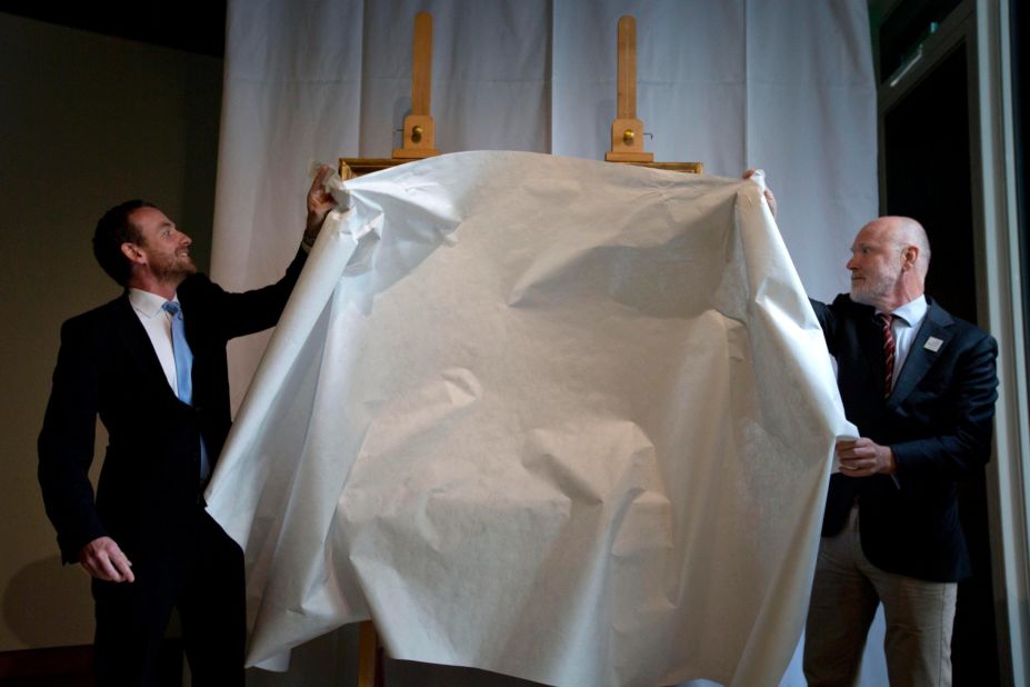 Van Gogh Museum director Axel Ruger, and senior researcher Louis van Tilborgh, right, unveil the newly discovered painting by Dutch painter Vincent van Gogh during a press conference at the museum in Amsterdam, Netherlands, Monday, September 9.