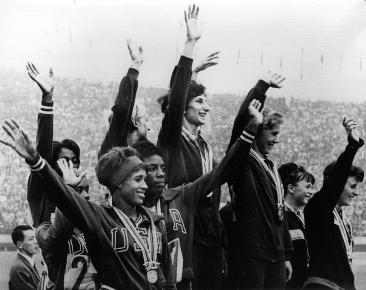 October 21, 1964: The Polish winners of the women's 4 x 100 meters relay race celebrate on the podium, with the American team who came second and the British team who came third.