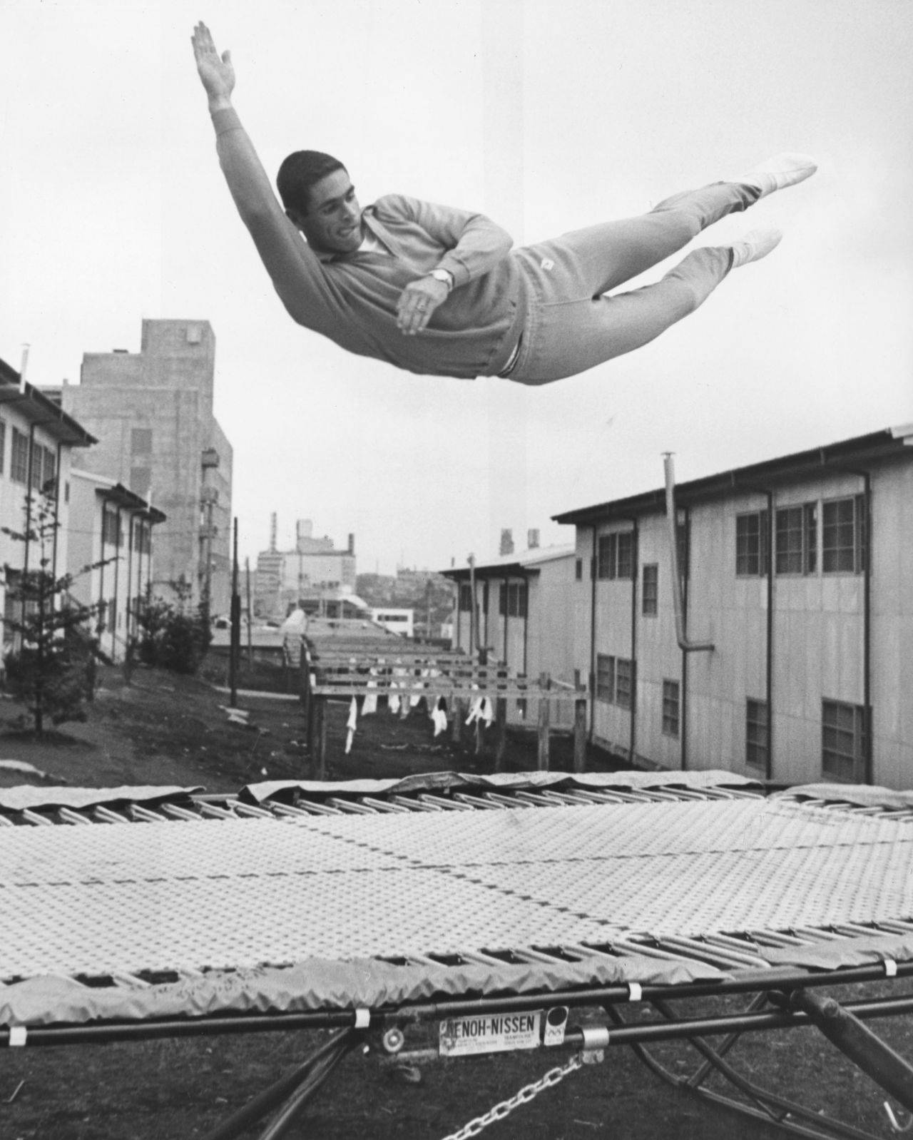 October 1, 1964: American pole vaulter Fred Hansen trains on a trampoline at the Olympic village in Tokyo. 