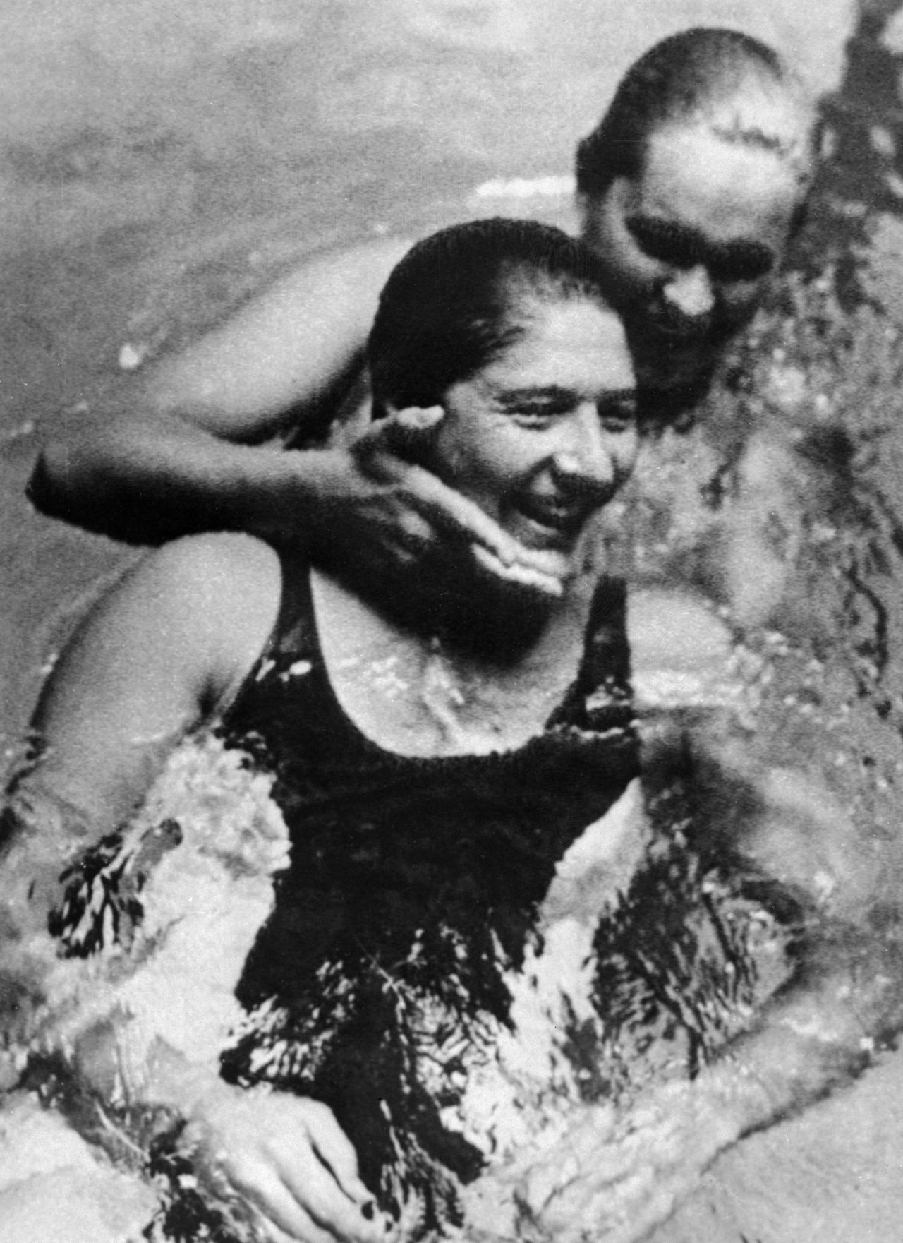 Australian swimming champion Dawn Fraser (in front) with her country fellow Linda McGill before the race where she set a new 100 meter record and became the first ever woman to finish in under a minute. During her career, she won eight Olympic freestyle medals, including four golds, and beat 27 world records.