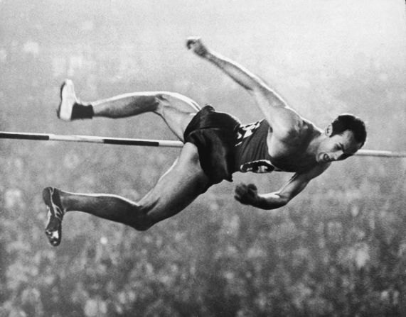Soviet athlete Valery Brumel (1942 - 2003) clears the bar at 2.18 meters in the high jump event during on October 21, 1964. Brumel set six world records, won the silver medal in the 1960 Olympics and the gold medal at these Games.