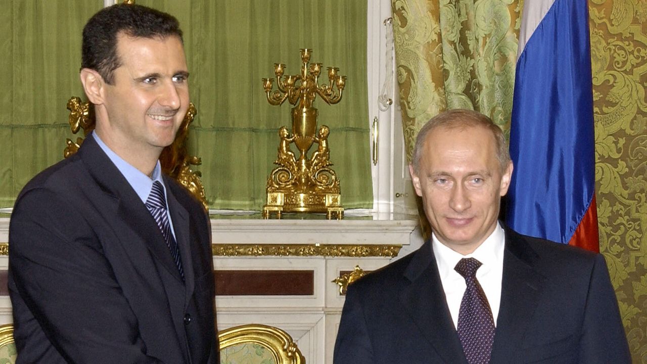 MOSCOW, RUSSIAN FEDERATION: Russian President Vladimir Putin (R) shakes hands with his Syrian counterpart Bashar al-Assad during their meeting in Moscow, 25 January 2005.
