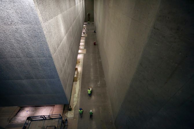 Contractors work to finish construction of the memorial and museum.