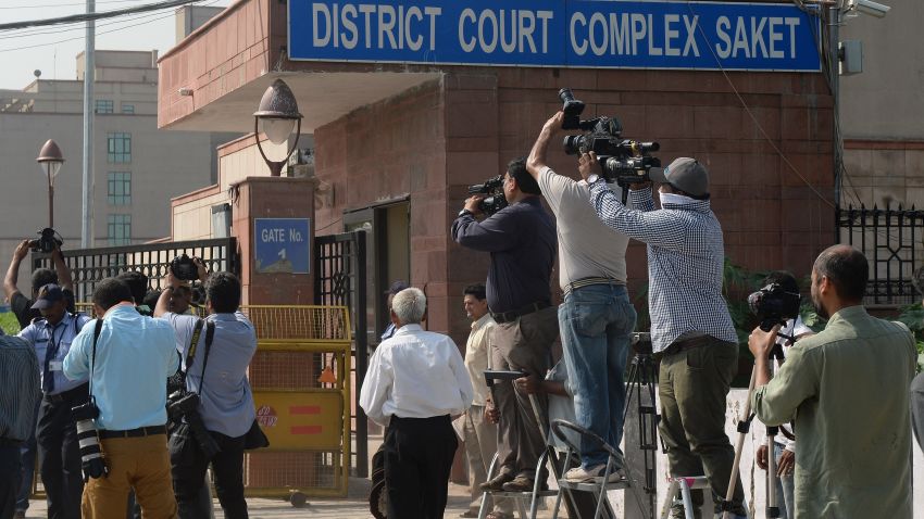 Photojournalists take pictures of a Delhi police van believed to be carrying the accused in a gangrape case as it enters Saket Court Complex in New Delhi on September 10, 2013. A judge is expected to hand down a verdict on four men accused of the fatal gang-rape of an Indian student on a bus, which could see the defendants sentenced to death. The parents of the popular physiotherapy student have been at the forefront of calls for the four to be hanged over the December 16 attack in New Delhi which triggered mass protests as well as new anti-rape laws.