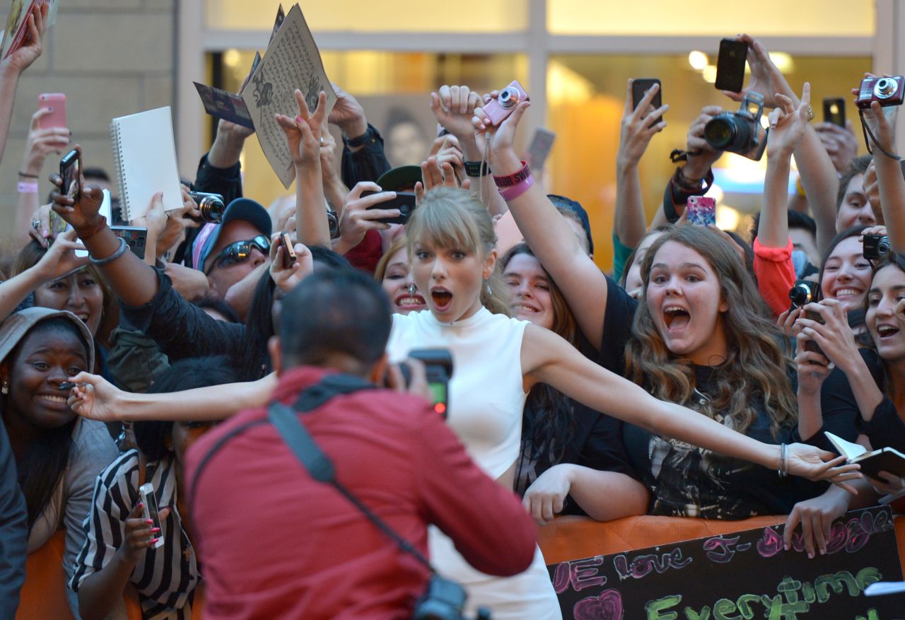 Taylor Swift appears at the "One Chance" premiere on September 9. The singer wrote a song for the movie.