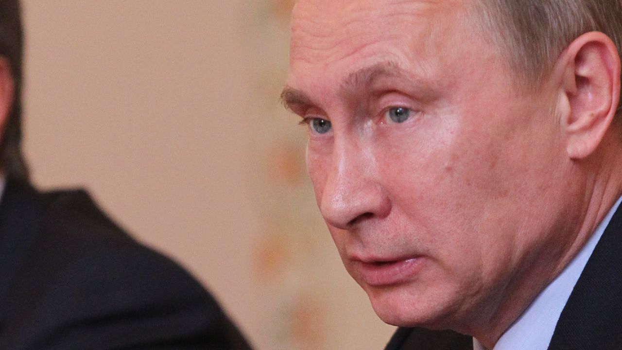 Russian President Vladimir Putin speaks as his Depyuty Chief of Staff Vyacheslav Volodin (left) looks on during a meeting in 2013.