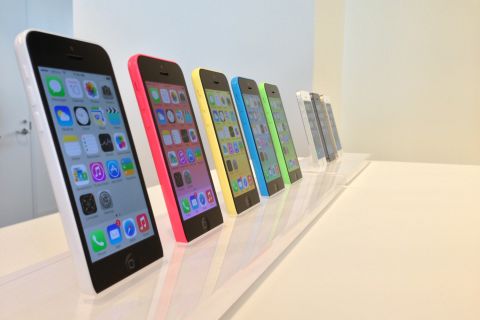 The latest additions to the iPhone line -- the colorful iPhone 5C, left, and higher-end iPhone 5S -- mark the first time Apple has launched two new versions of the phone. Initial reviews have been positive.
