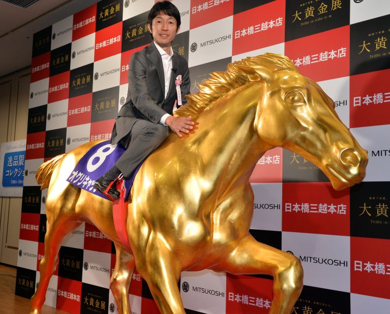 Japan's most famous  jockey is Yutaka Take, who has been likened to the David Beckham of his sport. Here the veteran is on board a golden replica of Oguri Cap, which won four Grade One races.