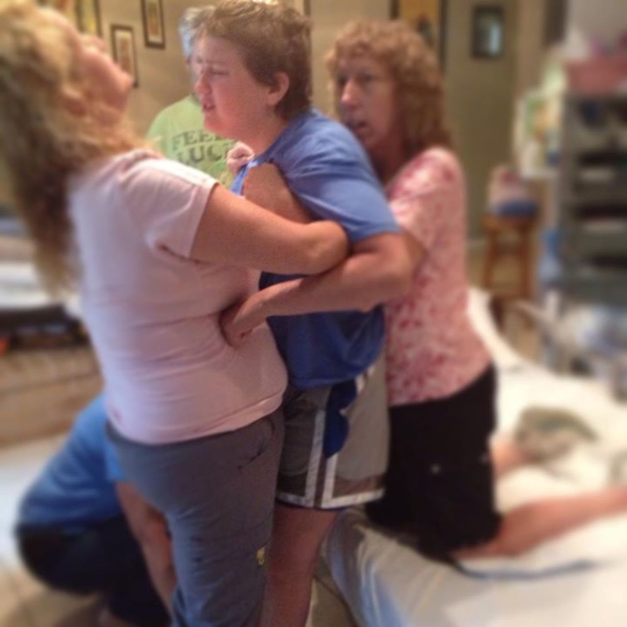 Emily struggles to stand with some help on April 26. "Thank you for all your positive comments. It's a new day and I'm much ... happier today than I was yesterday," she told her mother to share on Facebook.