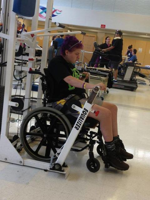 Emily ends the month of May by pumping iron in her wheelchair.