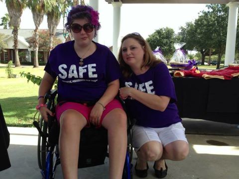 Emily strikes one of her signature faces as she poses with her mom, Tonya Bauer, at a golf tournament fundraiser for <a href="https://www.facebook.com/safe4emily" target="_blank" target="_blank">SAFE</a> in August.