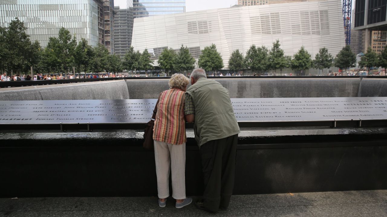 Visitors check out victims' names at the 9/11 Memorial in New York on September 10.