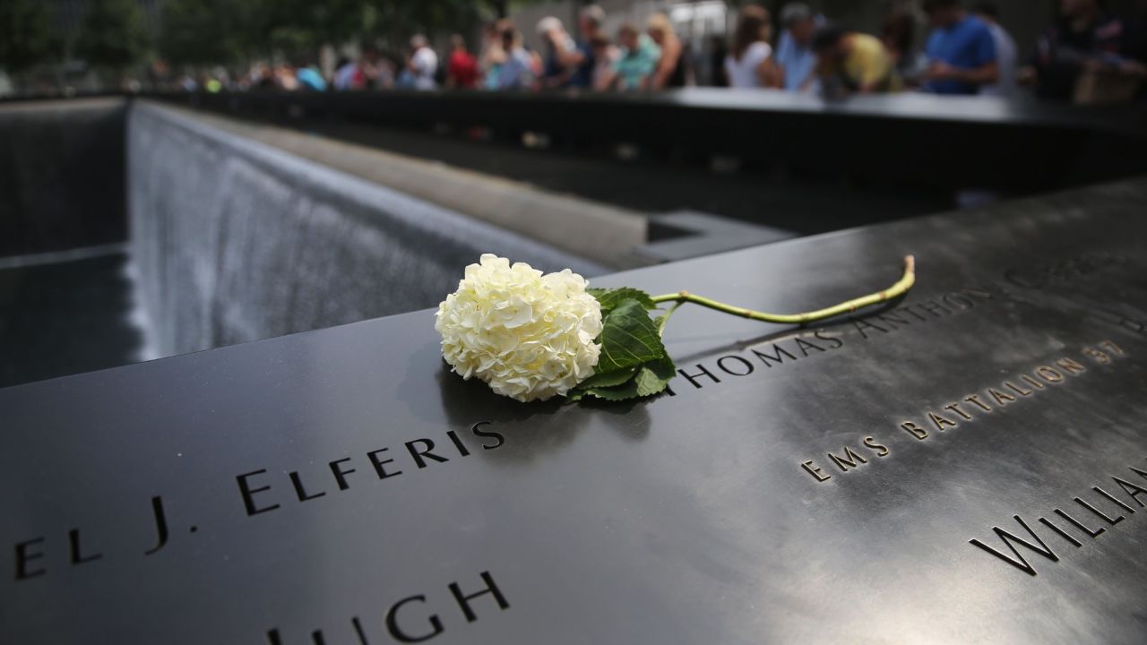 A flower lies atop names of victims at the 9/11 Memorial in New York on September 10.