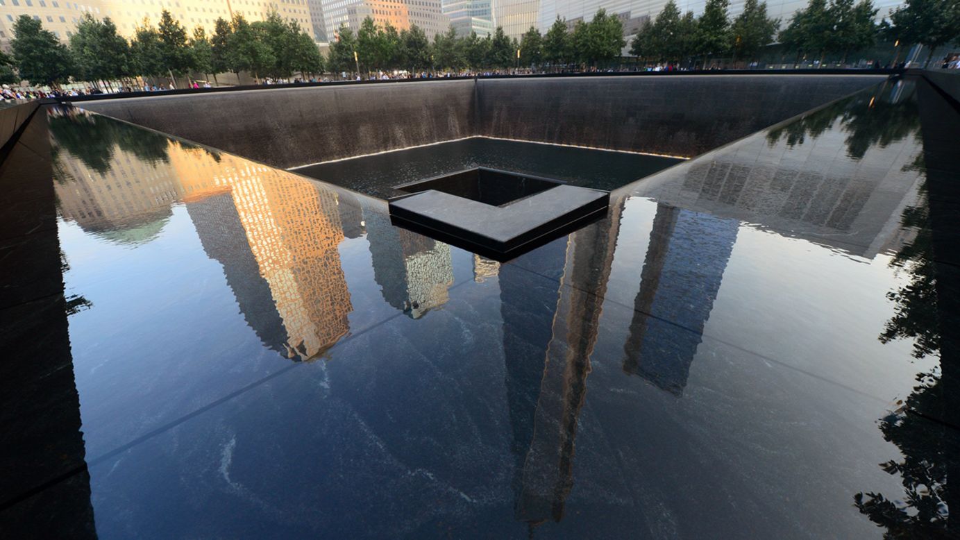 A pool at the 9/11 Memorial in New York reflects surrounding buildings during ceremonies for the 12th anniversary of the terrorist attacks.