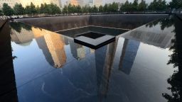 Buildings are reflected in one of the pools of the 9/11 Memorial in New York City on September 11, during ceremonies for the 12th anniversary of the terrorist attacks.