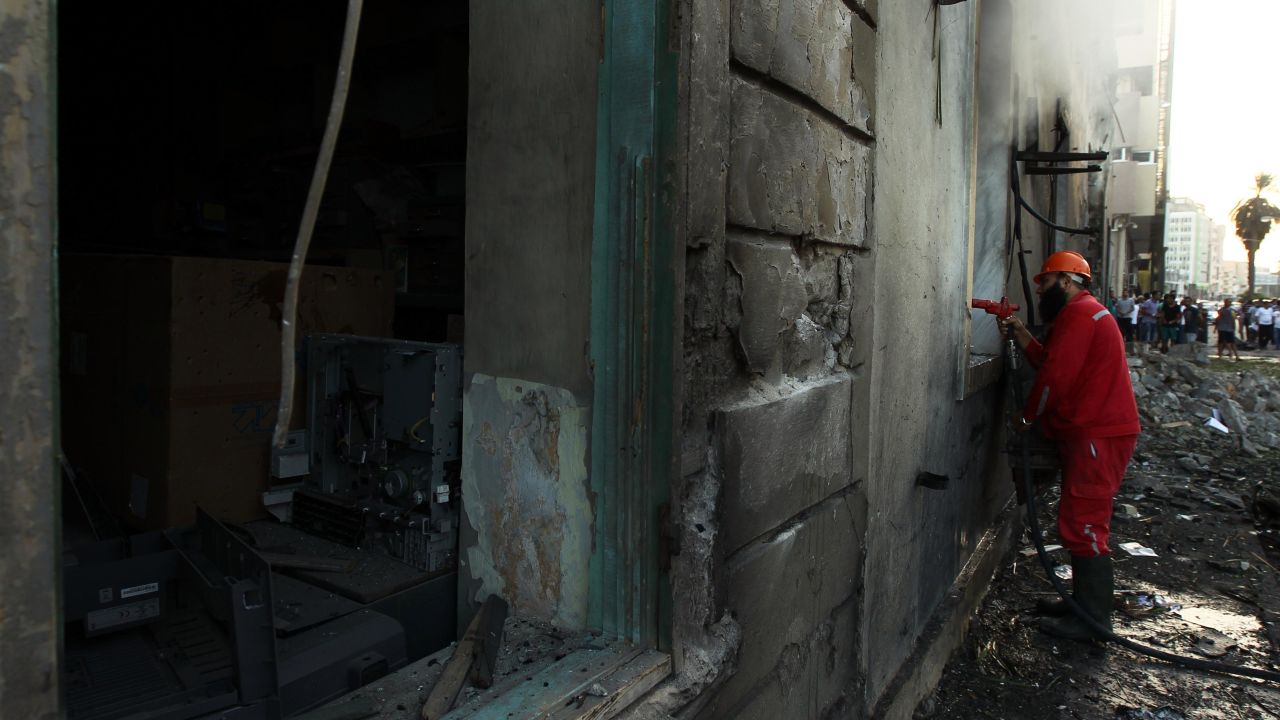 A firefighter douses the inside of the building on September 11.