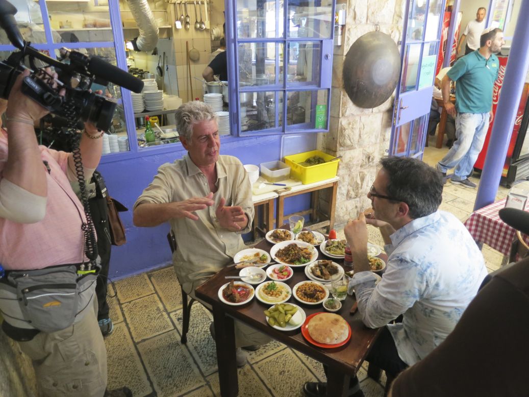 Anthony Bourdain and chef Yotam Ottolenghi enjoy a meal at Azura restaurant in Jerusalem.