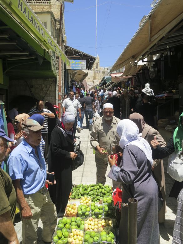 Vendors sell vegetables at a market in Jerusalem's Old City.