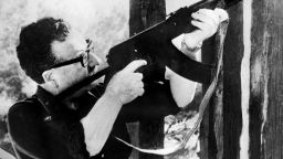 (FILE) Picture taken circa 1971 in Santiago, showing Chilean President Salvador Allende testing a Kalashnikov machine gun given to him as a gift by then-Cuban President Fidel Castro. Experts studying the remains of Salvador Allende concluded the former president committed suicide as soldiers involved in a 1973 coup closed in on the presidential palace, the late leader's daughter said on July 19, 2011 in Santiago.