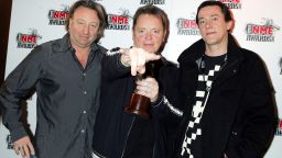 Peter Hook, Bernard Sumner and Steven Morris pose for the cameras in 2005.