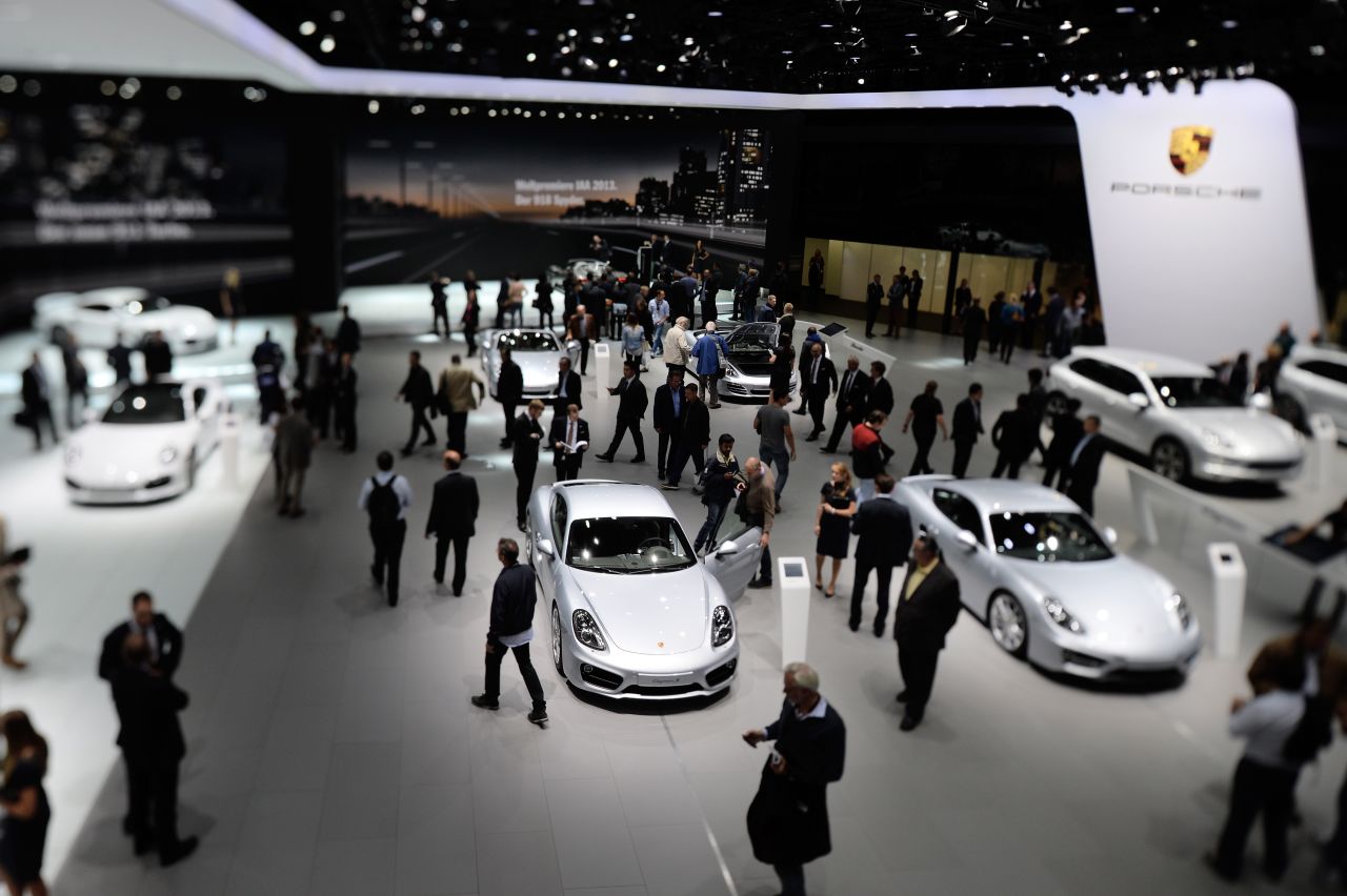 Visitors look at Porsche cars at the IAA international automobile show on September 11, 2013 in Frankfurt, Germany.