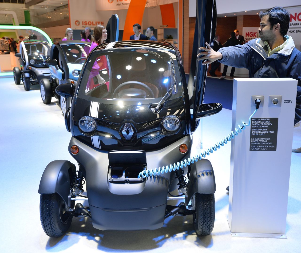 A visitor closes the door of the Renault Twizy electric drive at the IAA international automobile show on September 11, 2013 in Frankfurt, Germany.