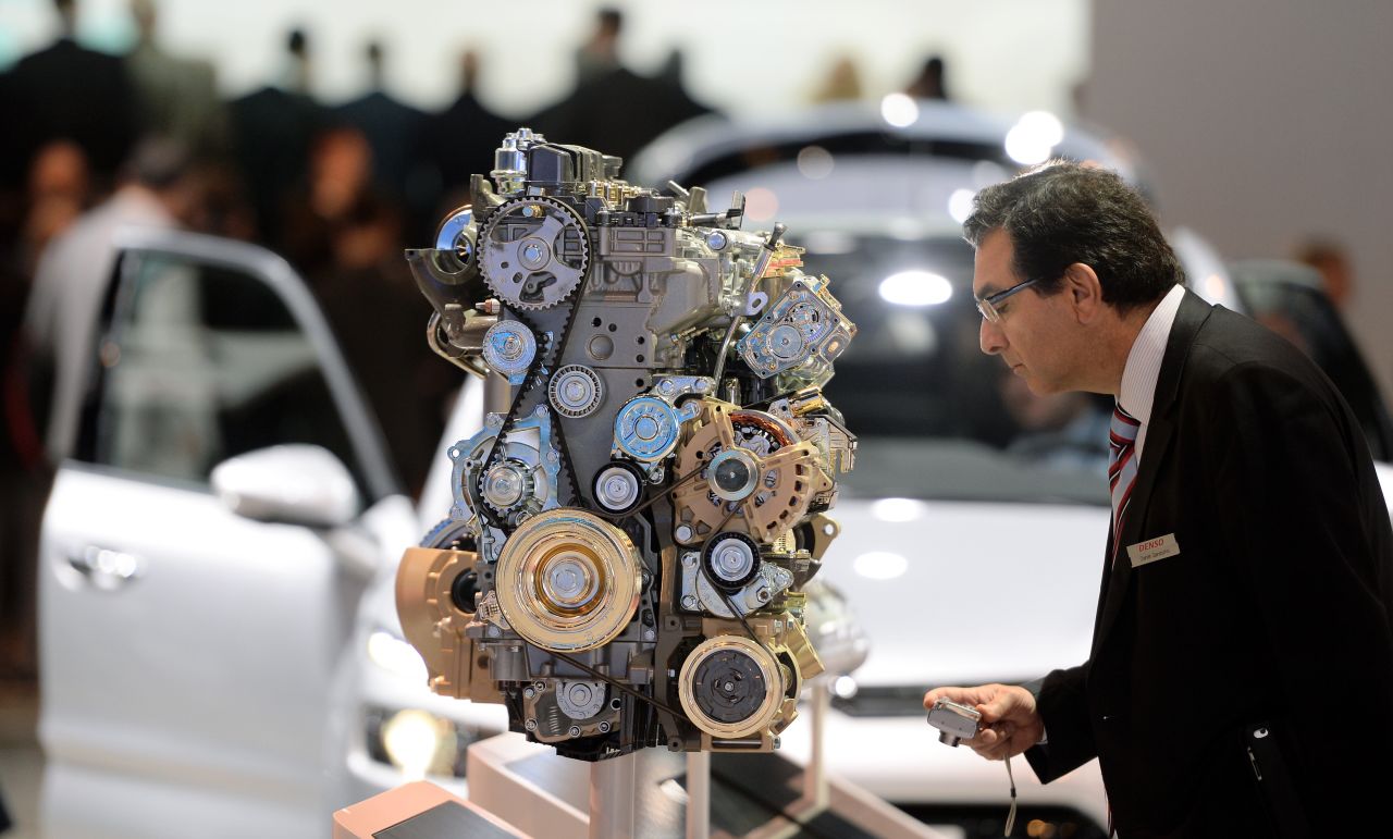 A visitor looks at an Citroen diesel enging at the IAA international automobile show on September 11, 2013 in Frankfurt, Germany.