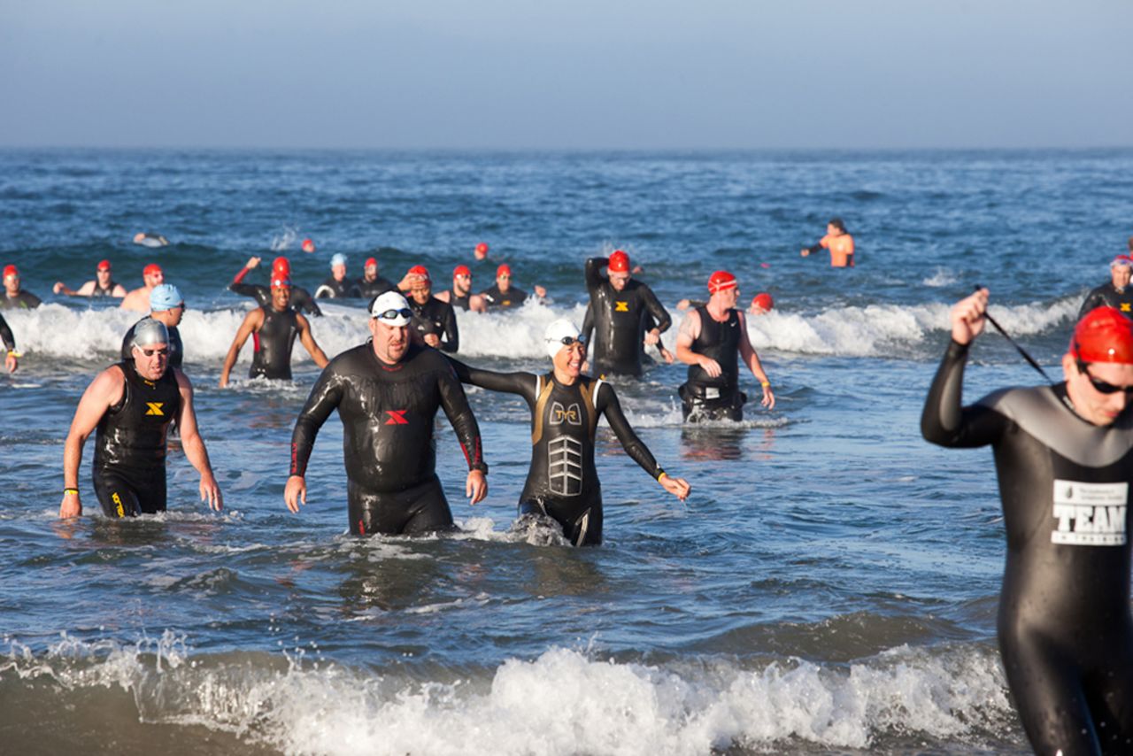 Mantooth, second from left, exits the water after the half-mile ocean swim. He <a href="http://ireport.cnn.com/docs/DOC-890415">was a huge fan of triathlons</a> but had never tried doing one before joining the CNN Fit Nation team.