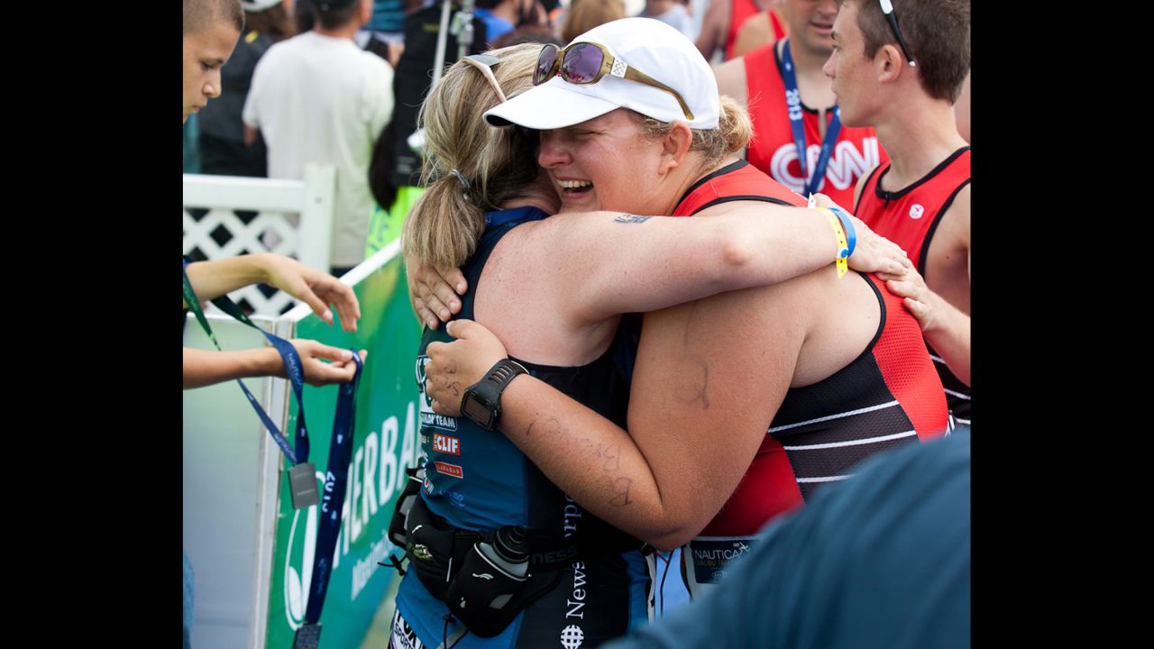 McMahon hugs a fan after finishing the race. During her sophomore year at Indiana University, she was <a href="http://www.cnn.com/2013/02/08/health/fit-nation-tabitha-family-love">diagnosed with ulcerative colitis</a>, a type of inflammatory bowel disease. Since then she's had several complications and additional surgeries. She says joining the Fit Nation team has helped her regain a bit of control over her health.