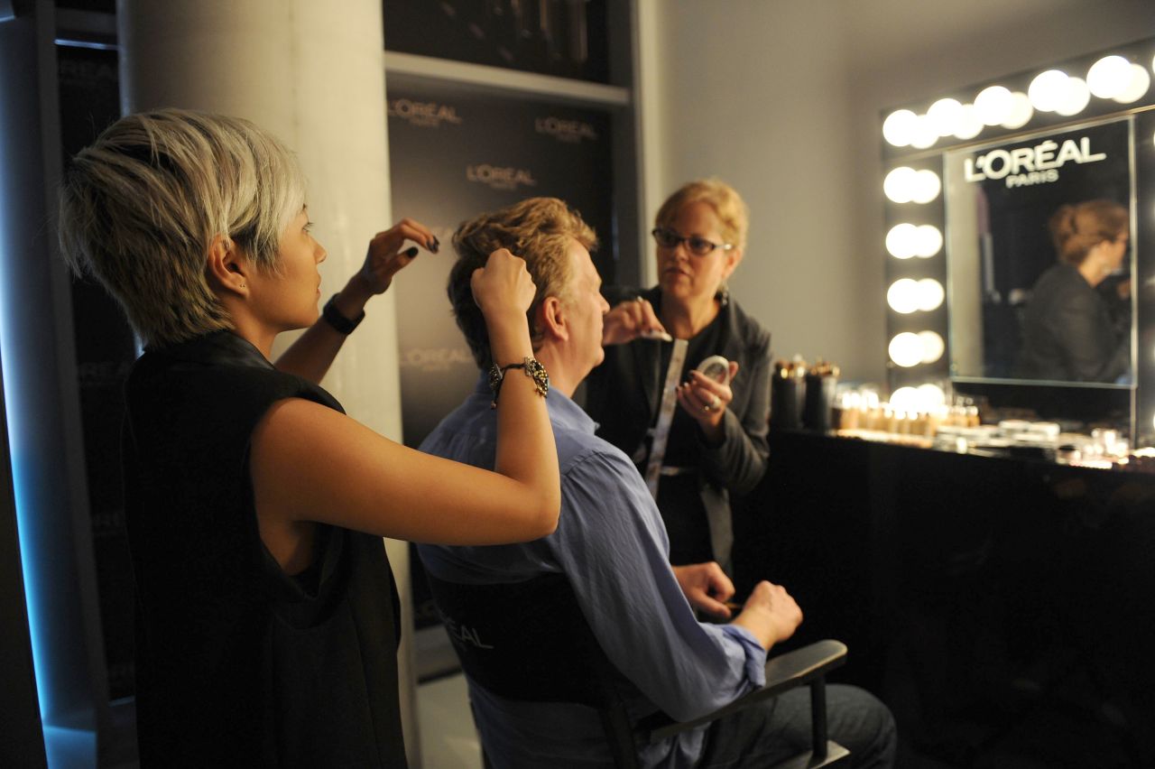 Bruce Alcock receives hair and makeup services at the Guess Portrait Studio on September 11.
