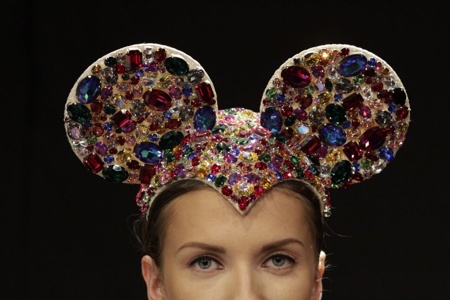 A model wears elaborately decorated mouse ears on stage at milliner Anya Caliendo's show.