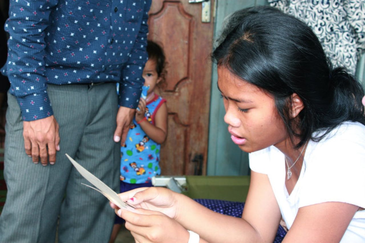 U.S. adoptee Srey Powers traveled to Cambodia in 2010 to find her birth family. Powers: "Here I'm seeing a picture of my mother for the first time."