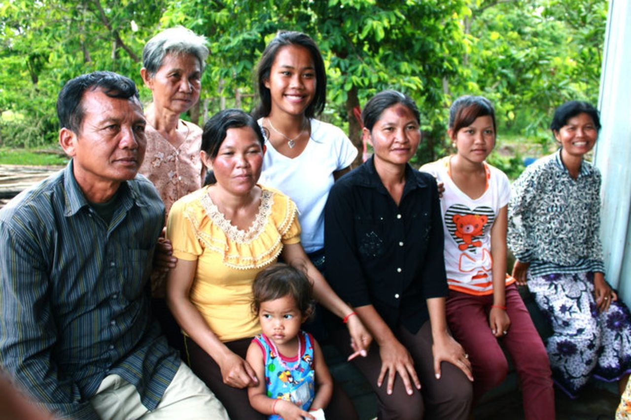 Powers with her Cambodian family. "The women are my mother's sisters."