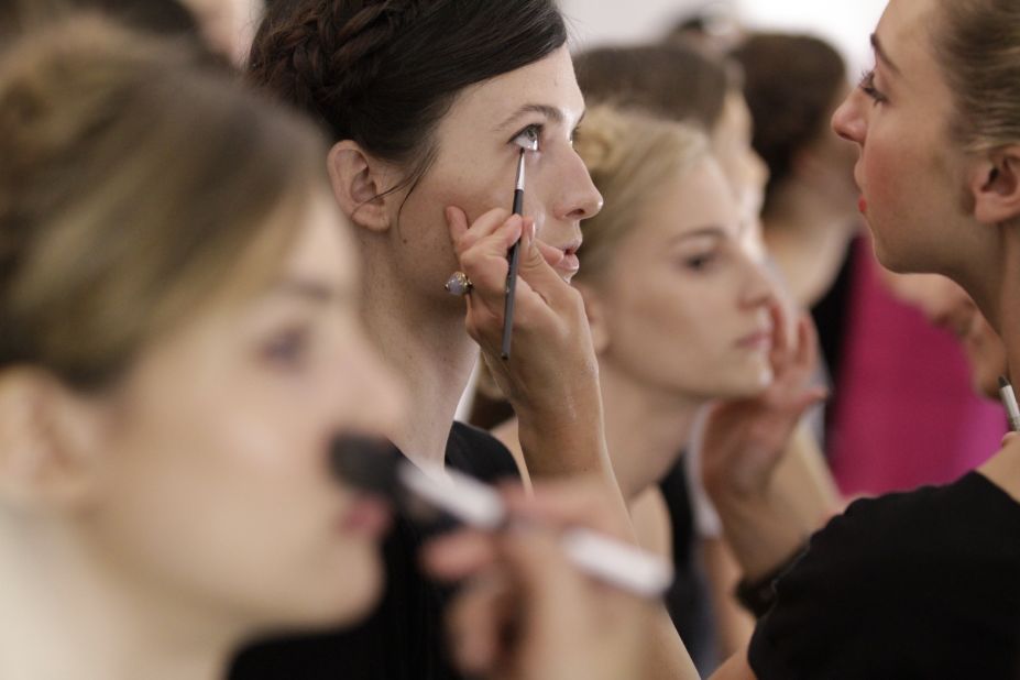 Models get their makeup done before the Rebecca Minkoff show.