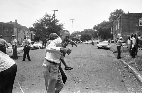 A grieving relative is led away from the site of the <a href="http://www.cnn.com/2013/06/13/us/1963-birmingham-church-bombing-fast-facts/index.html">16th Street Baptist Church bombing</a> in Birmingham, Alabama, on September 15, 1963. Four black girls were killed and at least 14 others were injured, sparking riots and a national outcry.