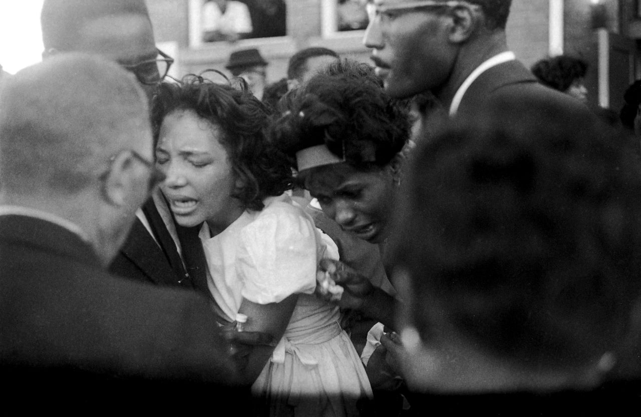 Mourners embrace at the funeral. In his eulogy, Dr. King said, "These children -- unoffending, innocent and beautiful -- were the victims of one of the most vicious and tragic crimes ever perpetrated against humanity."
