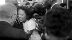 Mourners embrace at the girls' funeral. In his eulogy, Dr. King said, "These children -- unoffending, innocent and beautiful -- were the victims of one of the most vicious and tragic crimes ever perpetrated against humanity."