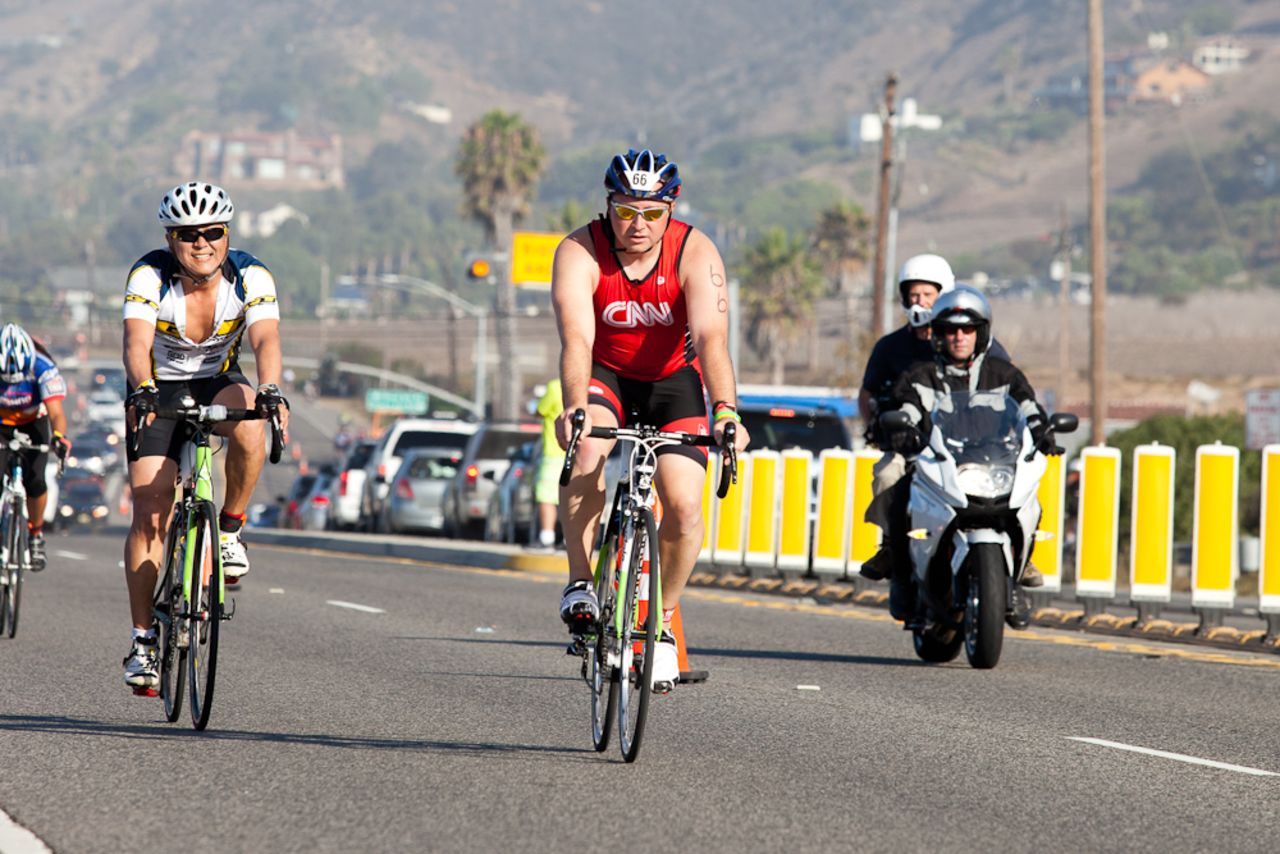 Mogle stays strong during the cycling leg of the race. He was the first of the Fit Nation team to cross the finish line, but says simply finishing is <a href="http://www.cnn.com/2013/07/19/health/fit-nation-mogle-finishing/index.html">no longer his goal.</a> 