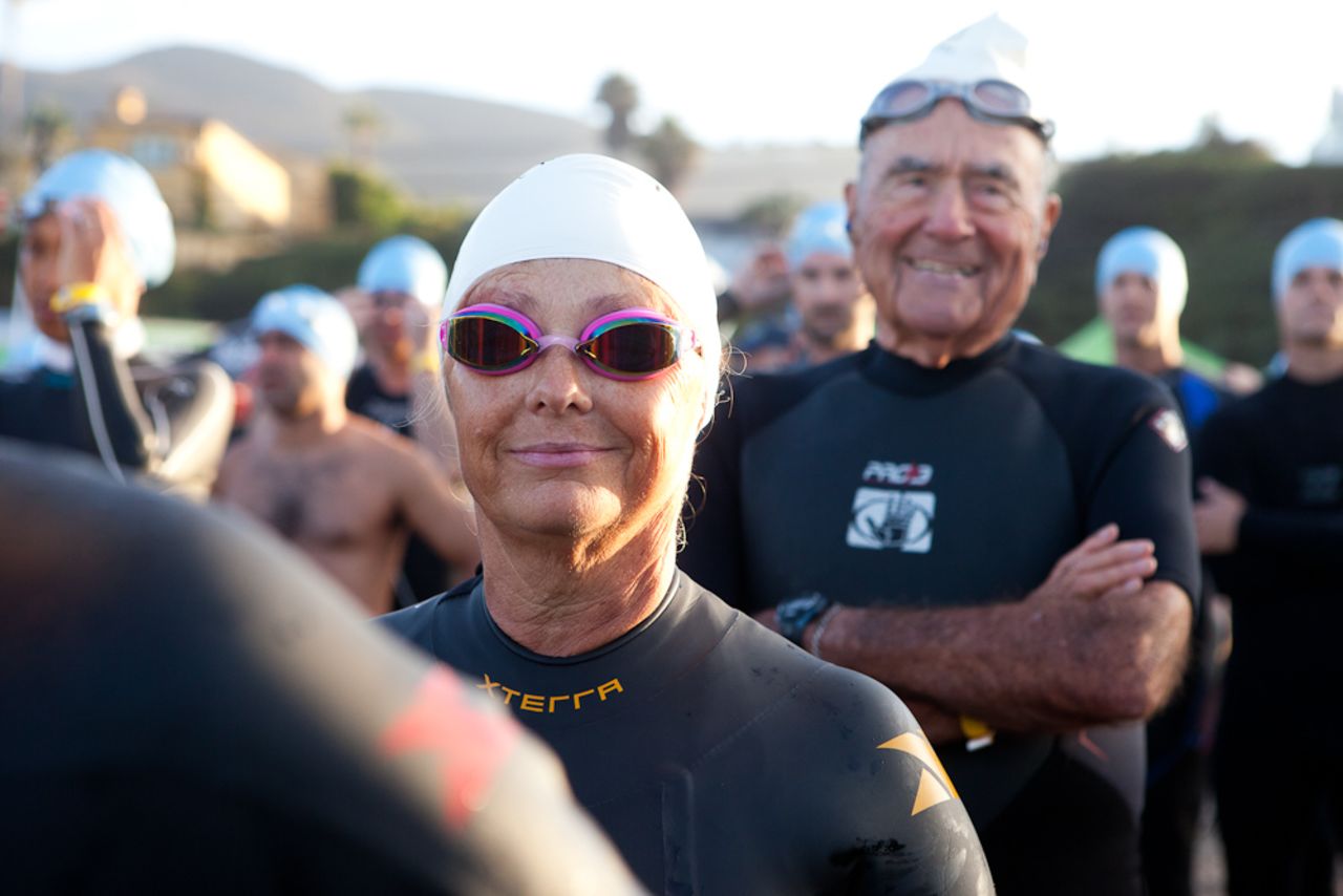 Timme prepares to enter the water for the first leg of the race early Sunday morning. At the beginning of the year, she couldn't even put her face in the water while swimming. During the midway trip to Florida she <a href="http://www.cnn.com/2013/05/17/health/fit-nation-timme-midway-trip">entered the ocean for the first time</a>.