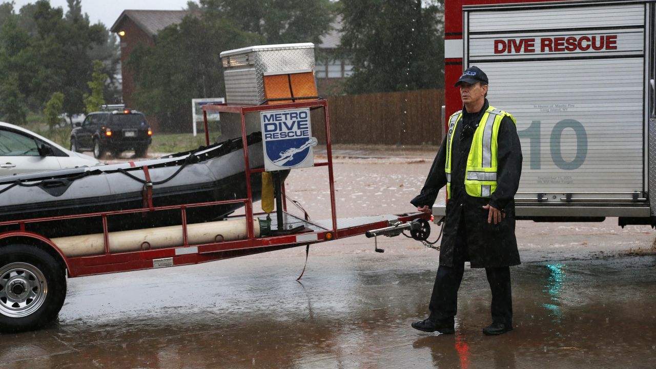 A dive rescue team moves toward floodwaters in Boulder on September 12.
