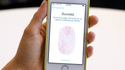 The new iPhone 5S with fingerprint technology is displayed during an Apple product announcement at the Apple campus on September 10, 2013 in Cupertino, California.