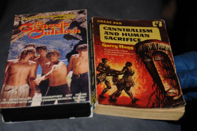 "The Genesis Children" VHS and "Cannibalism and Human Sacrifice" book are more of the disturbing items police found.