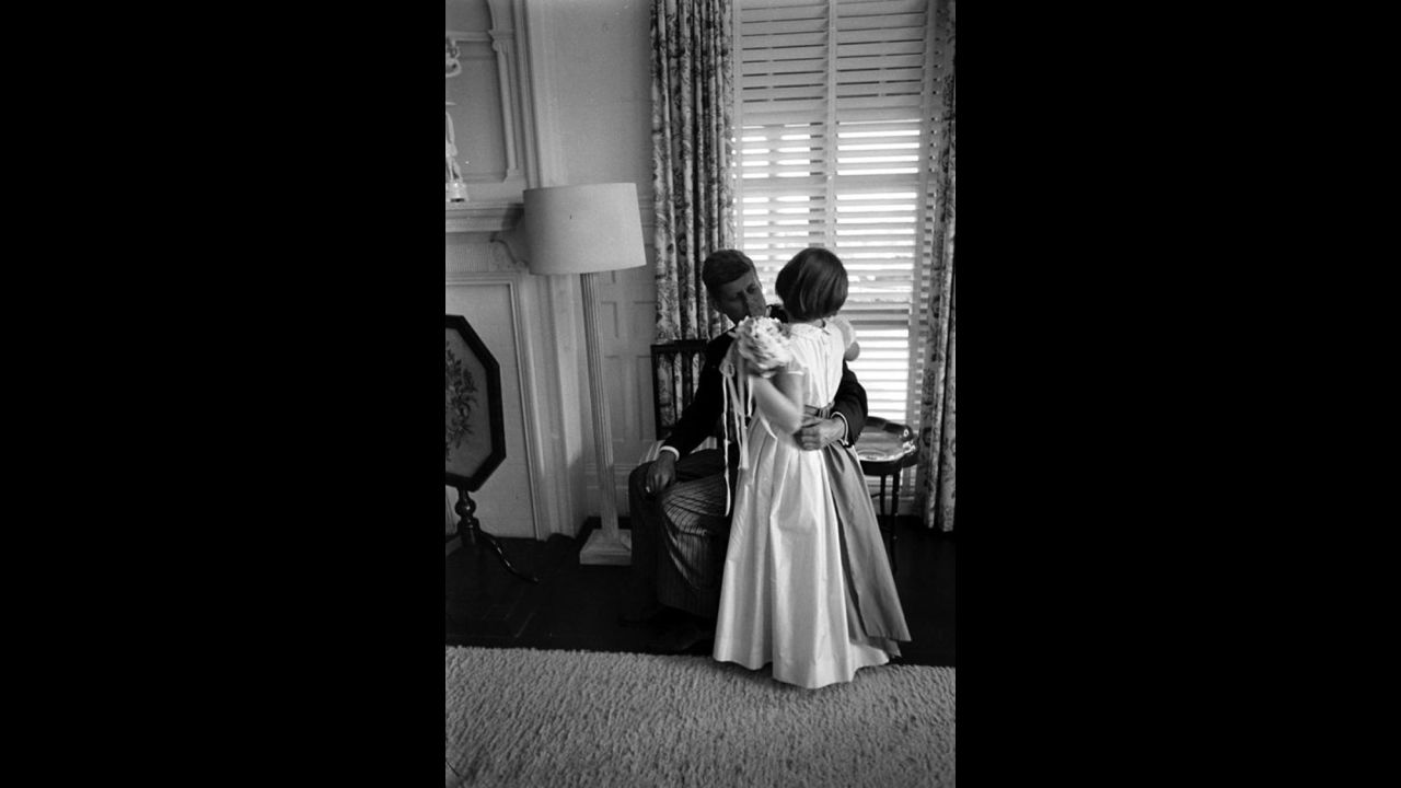 John Kennedy is greeted by a guest at the wedding.