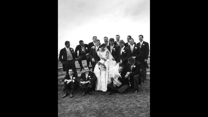 John and Jackie Kennedy are seen with groomsmen and other guests on their wedding day.