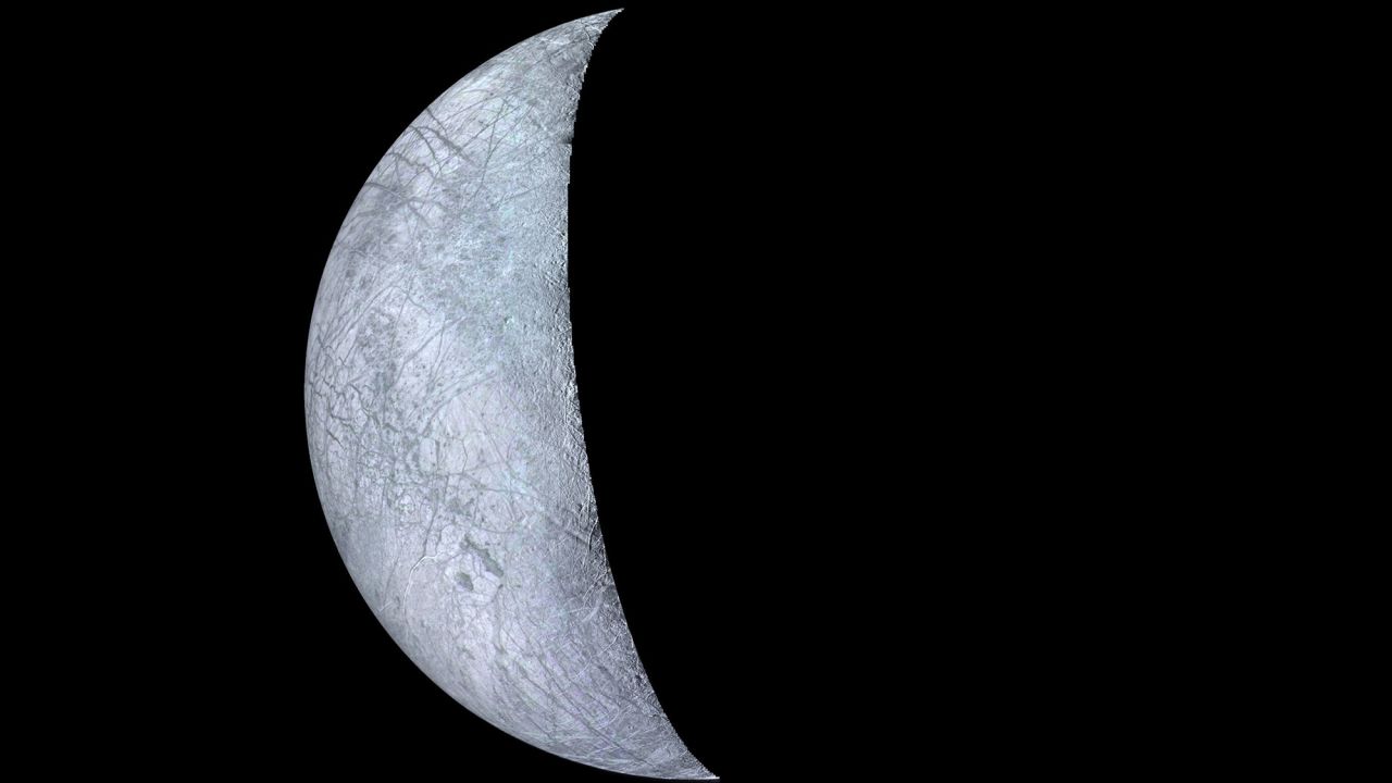 A mosaic of Europa, Jupiter's smallest moon, shows bright areas, likely ice deposits, and darker areas that may be the rocky surface or areas with a more patchy distribution of ice. The most unusual features are  systems of long linear structures that cross the surface in various directions, some of which are more than 1,000 kilometers long and about 2 or 3 kilometers wide. 